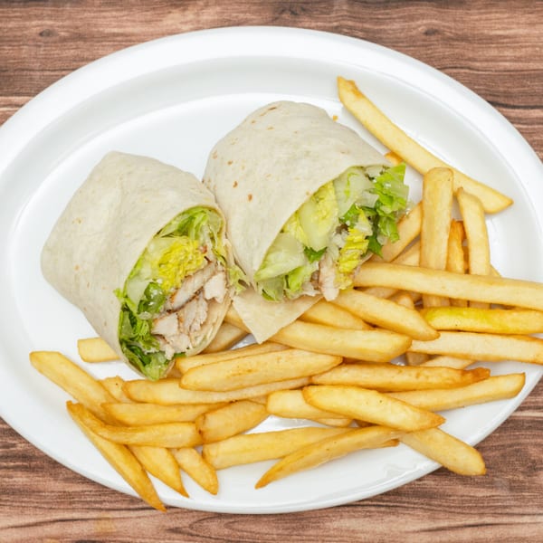Two chicken Caesar wraps with lettuce and cheese, served with a side of golden french fries.