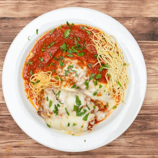 Allegro Pizza's chicken parmesan with spaghetti, marinara sauce, melted cheese, and fresh parsley.