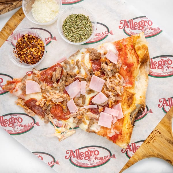 A slice of Allegro Pizza with pepperoni, ham, and sausage, alongside bowls of spices.