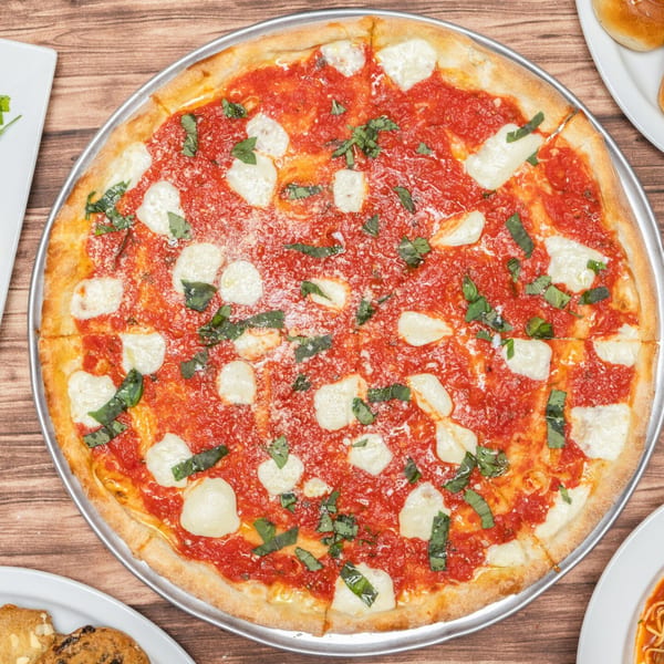 Allegro Pizza's Margherita pizza with fresh mozzarella, tomato sauce, and basil on a wooden table.